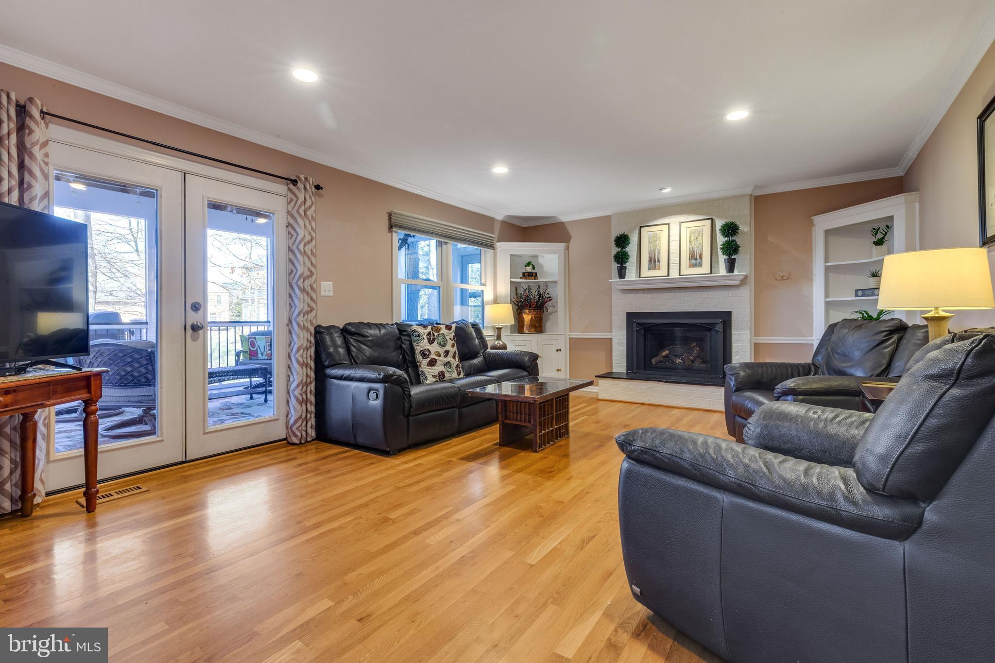 12332 Washington Brice Road Fairfax, VA 22033 - Photo 28 of 54 Family Rm w/Cozy Fireplace & Screened Deck Access!
