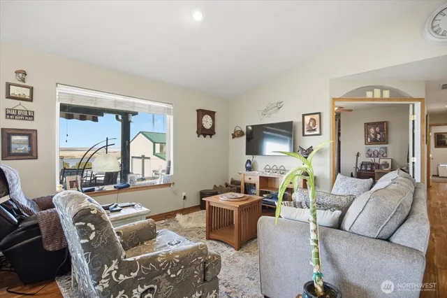 a living room with furniture and a large window