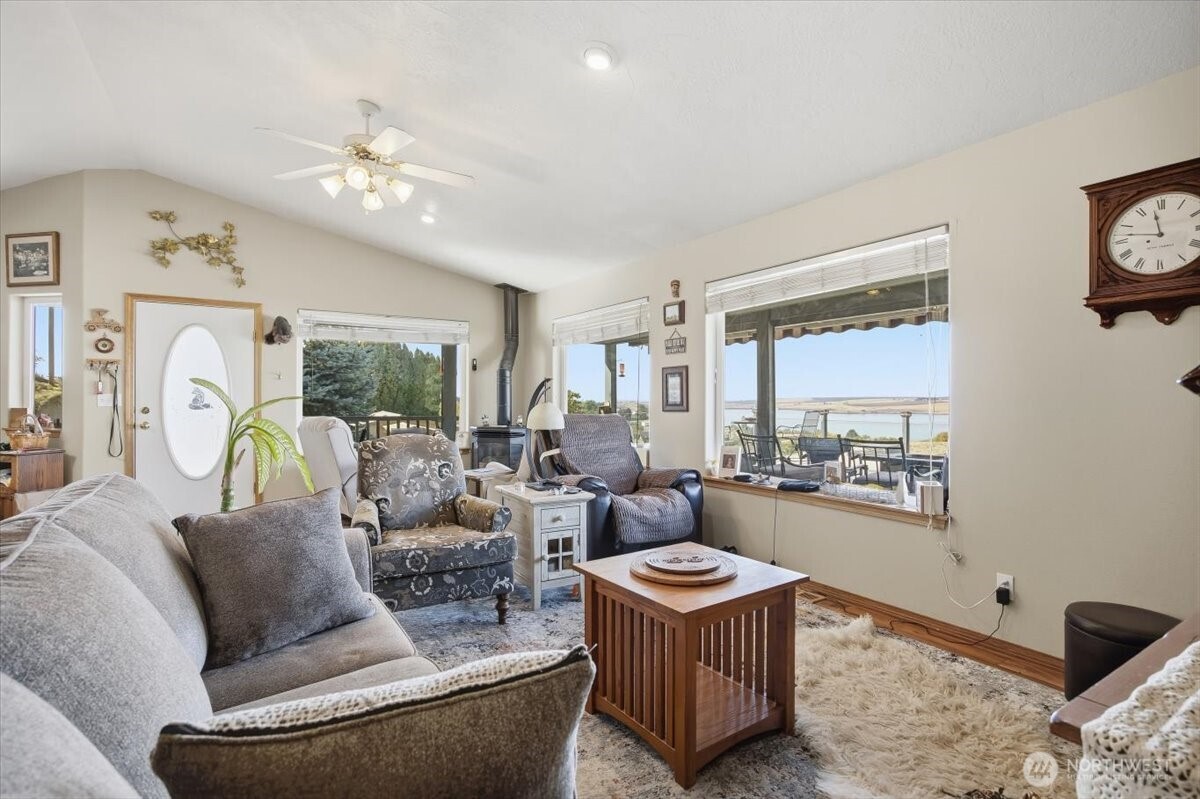 372 Harbor Boulevard Burbank, WA 99323 - Photo 15 of 31 a living room with furniture and a chandelier