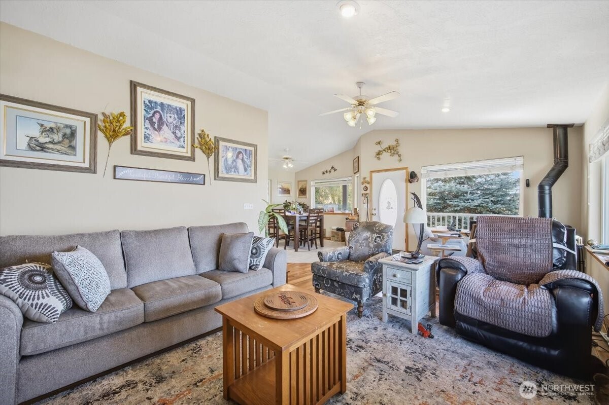 372 Harbor Boulevard Burbank, WA 99323 - Photo 16 of 31 a living room with furniture and a large window