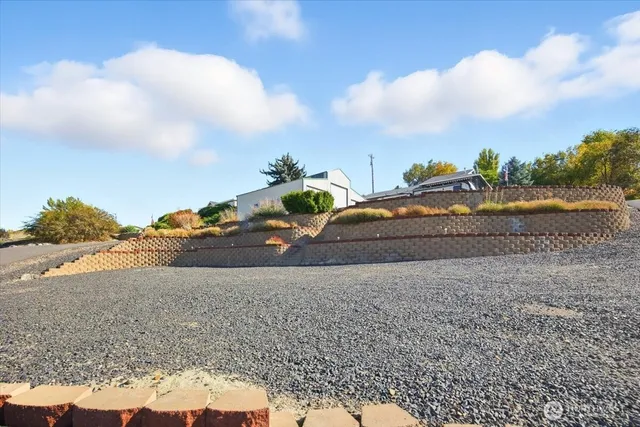 a view of car parked on the side of the road