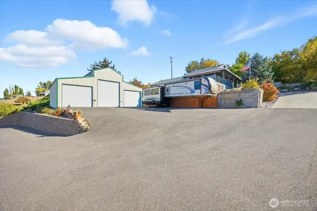 a view of a house with outdoor space and sitting area