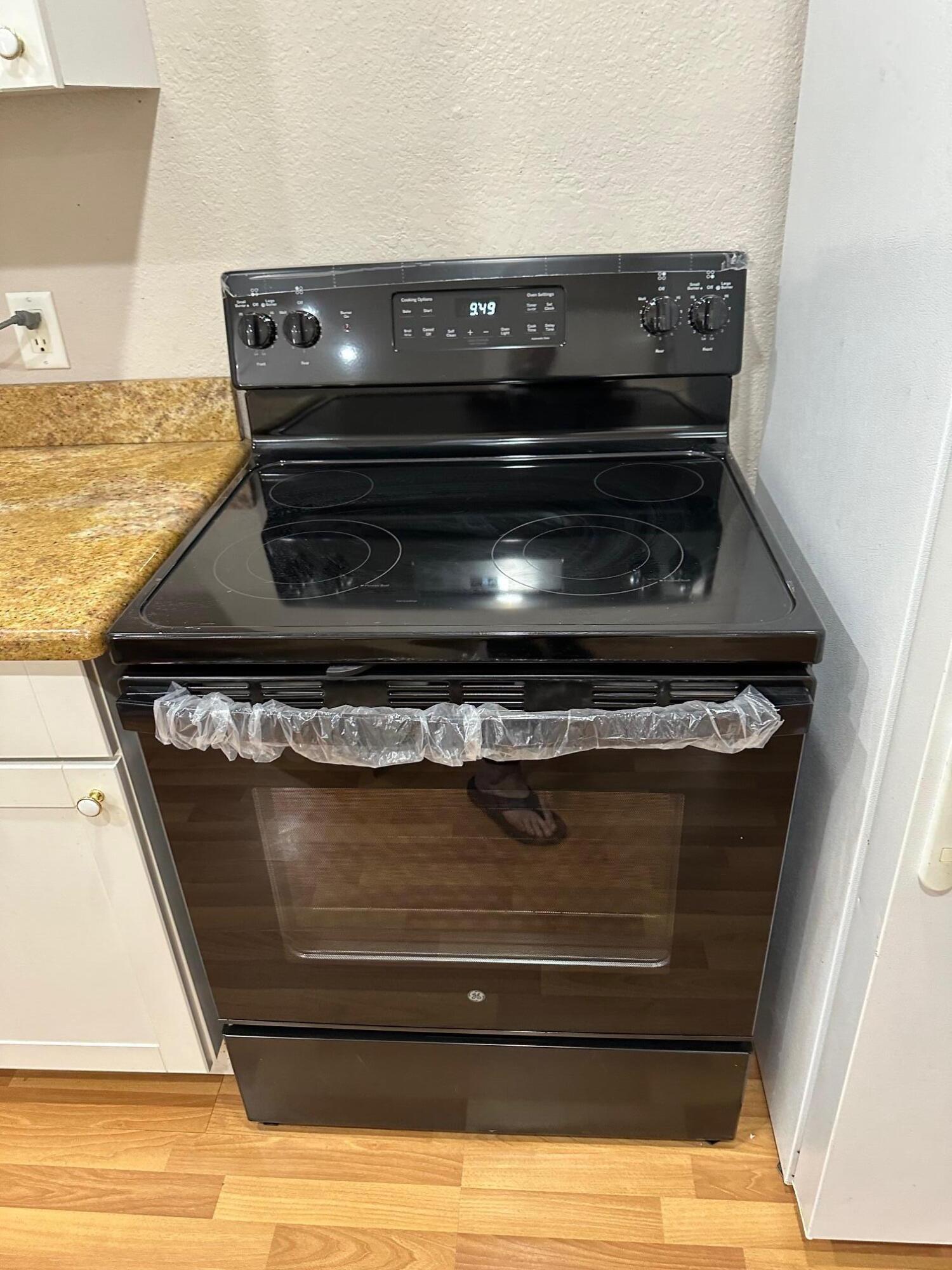 272 Southwest 1st Street, Unit B Boca Raton, FL 33432 - Photo 7 of 17 a stove top oven sitting inside of a kitchen