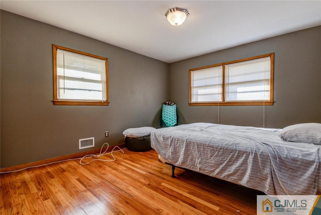 106 Rector Street Perth Amboy, NJ 08861 - Photo 13 of 20 a bedroom with a bed and window