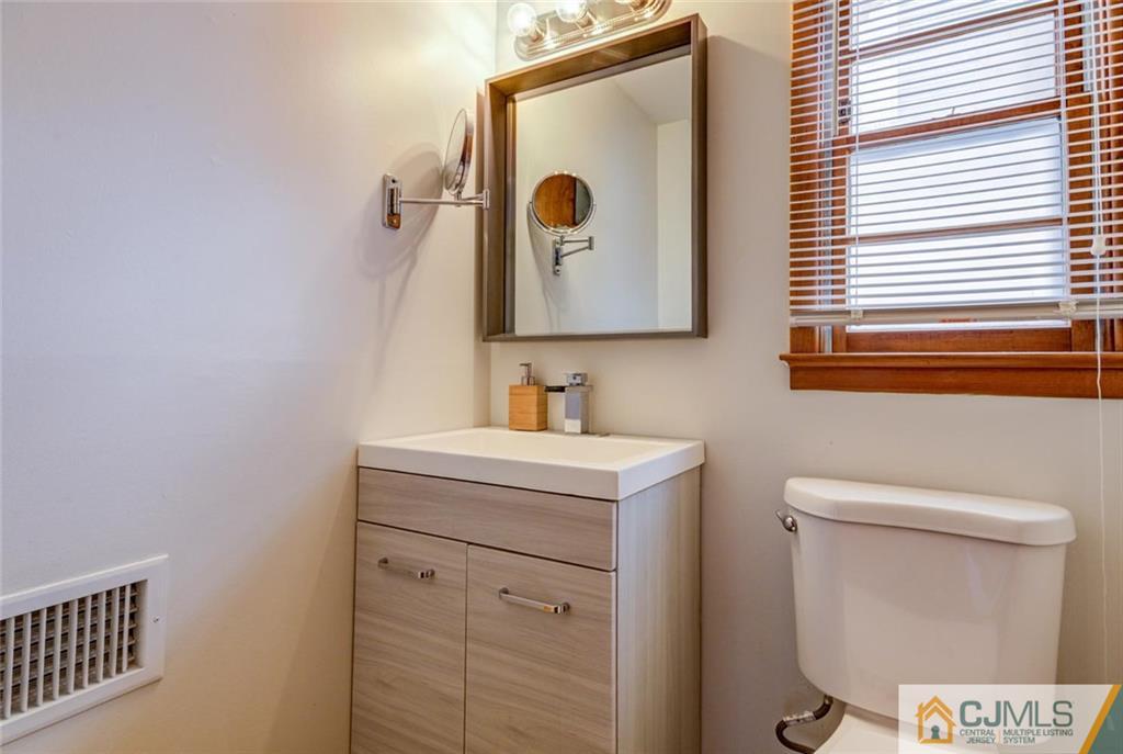 106 Rector Street Perth Amboy, NJ 08861 - Photo 17 of 20 a bathroom with a sink and a mirror