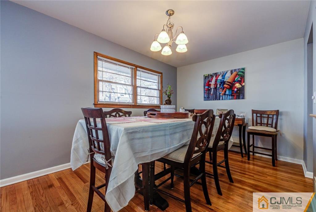 106 Rector Street Perth Amboy, NJ 08861 - Photo 9 of 20 a view of a dining room with furniture and wooden floor