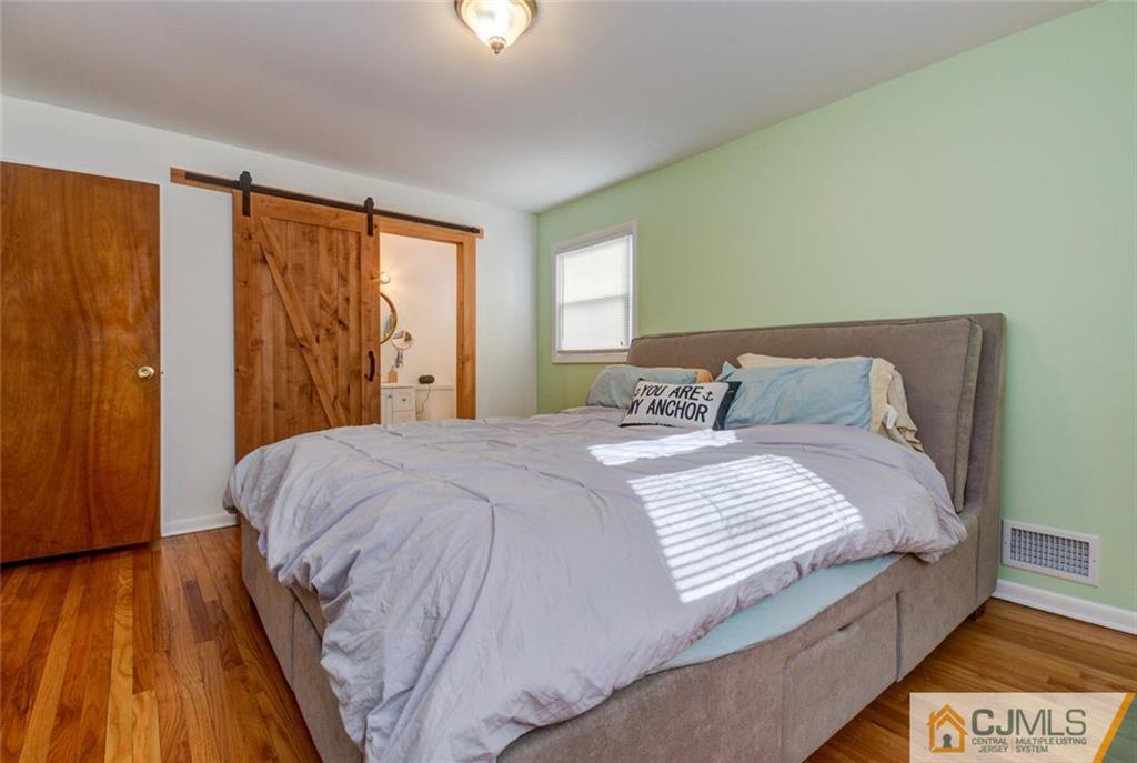 106 Rector Street Perth Amboy, NJ 08861 - Photo 10 of 20 a bedroom with a bed and a window