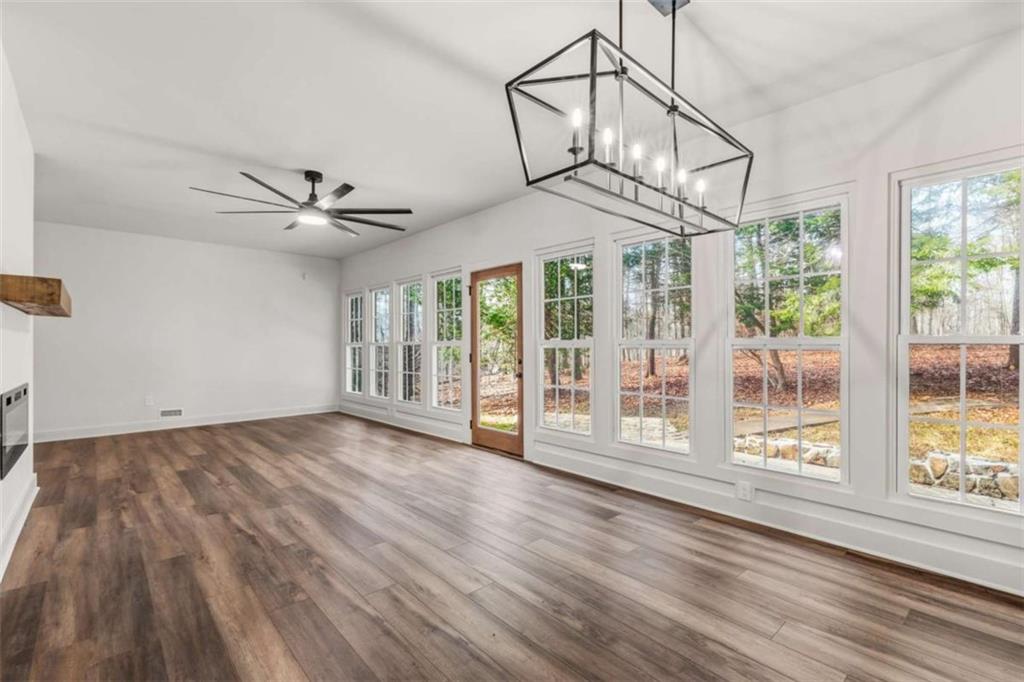 7448 Berea Road Winston, GA 30187 - Photo 18 of 42 a view of a livingroom with wooden floor and a ceiling fan
