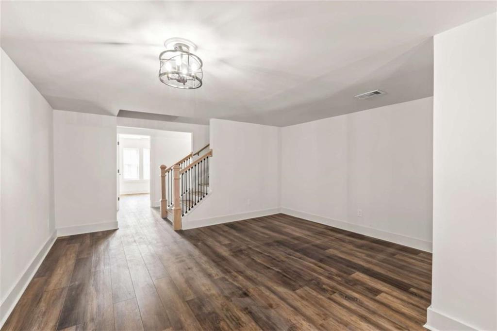 7448 Berea Road Winston, GA 30187 - Photo 31 of 42 a view of an empty room with wooden floor and a window