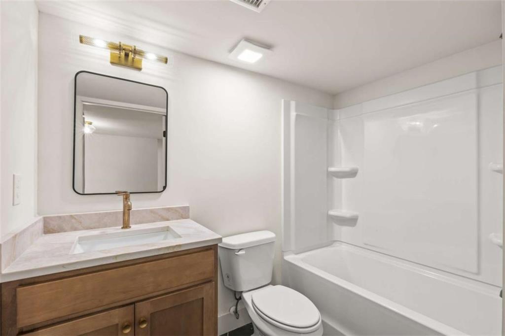 7448 Berea Road Winston, GA 30187 - Photo 33 of 42 a bathroom with a sink a toilet and shower