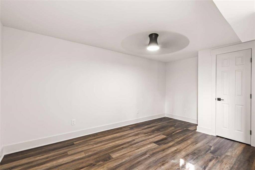 7448 Berea Road Winston, GA 30187 - Photo 34 of 42 a view of empty room with wooden floor and fan