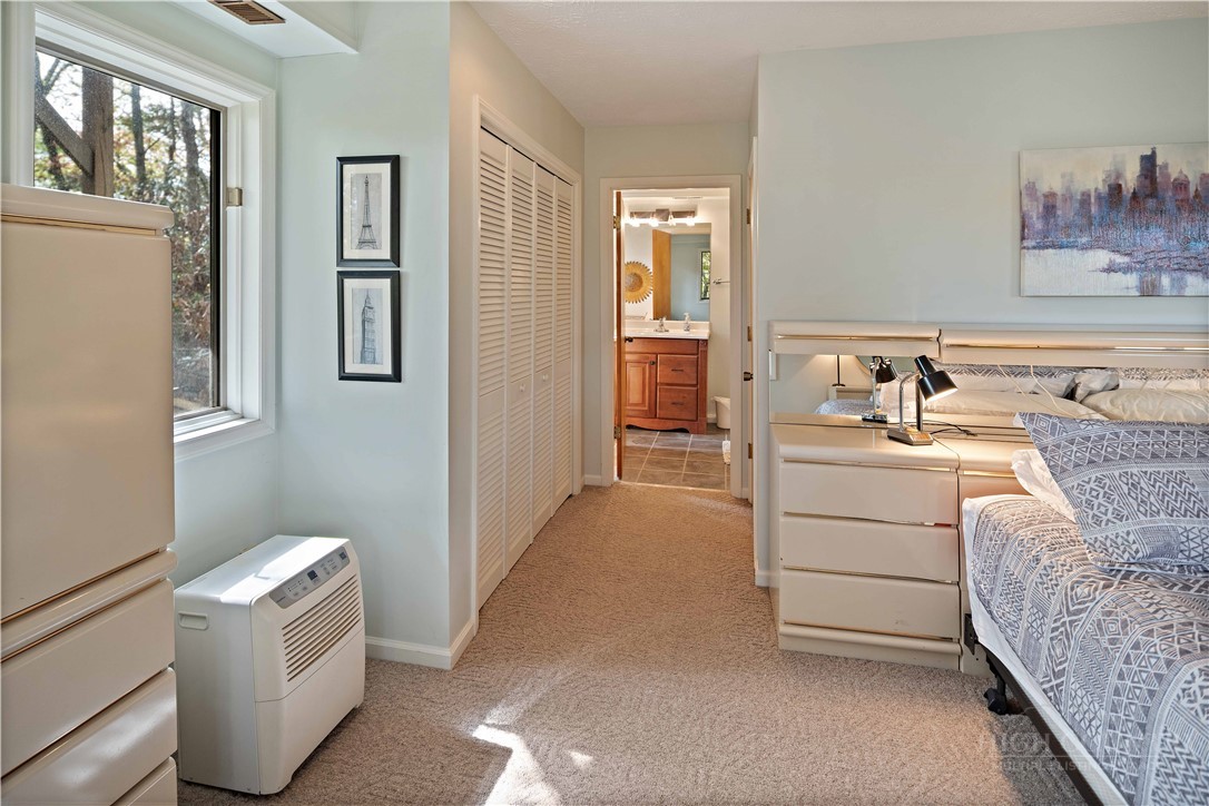 265 Leatherwood Road Banner Elk, NC 28604 - Photo 31 of 42 a room with a bed and a view of en suite bathroom