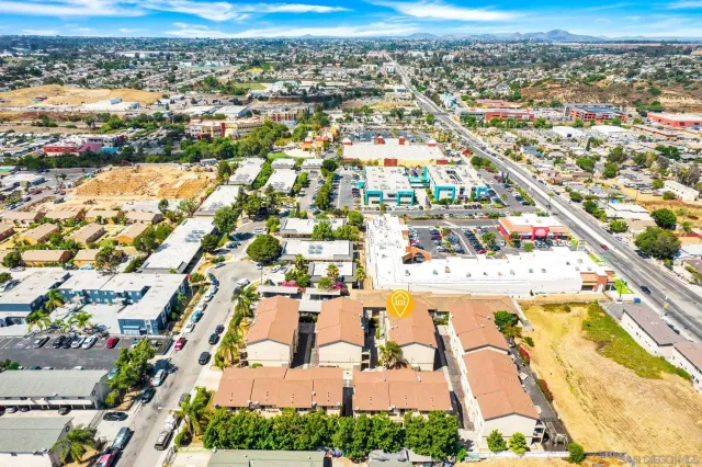 an aerial view of residential houses with outdoor space