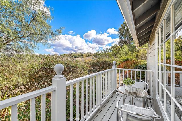 a view of balcony with furniture