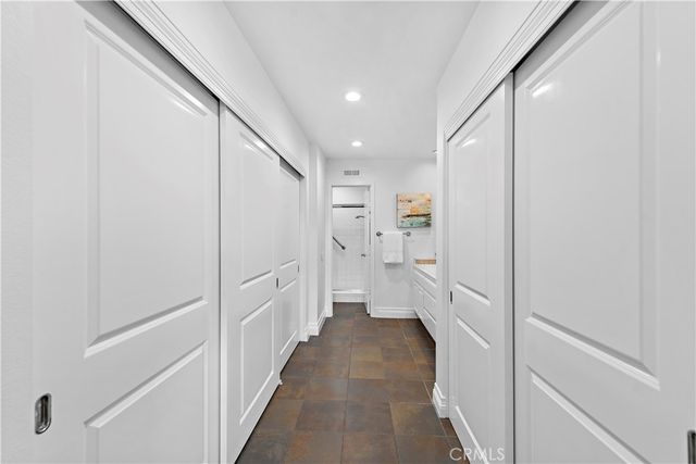 a view of a hallway with white walls