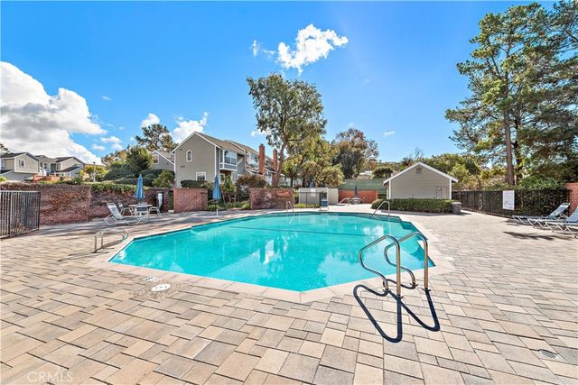 an aerial view of a house with a swimming pool yard and outdoor seating