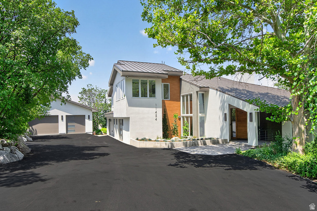 11454 South Oberland Road Sandy, UT 84092 - Photo 82 of 103 Contemporary exterior with a white stucco finish and wood-panel accents
