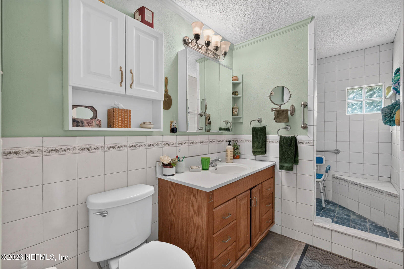1950 Lightsey Road St. Augustine, FL 32084 - Photo 25 of 57 a bathroom with a sink vanity toilet and shower