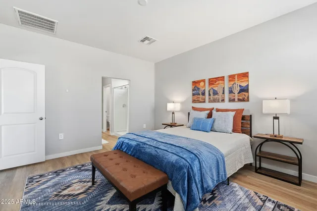 a bedroom with a bed and a dresser