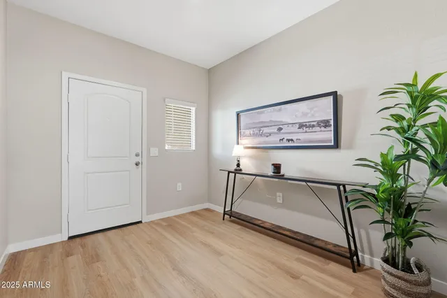 a view of workspace with furniture and a potted plant