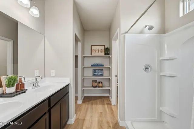 a en suite bathroom with a sink and a mirror