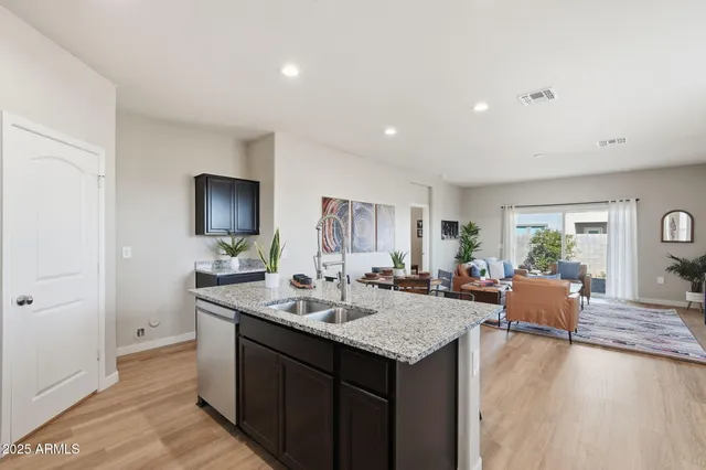 a view of living room with granite countertop furniture and fireplace