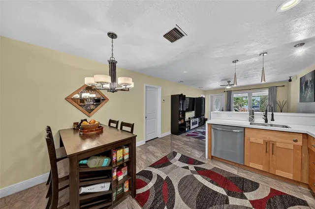 a very nice looking dining room with a table and chairs