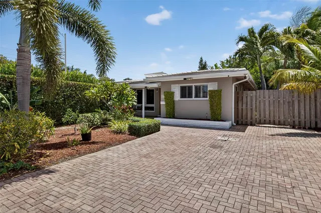 an aerial view of a house with swimming pool