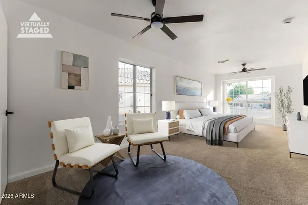 an empty room with windows and ceiling fan