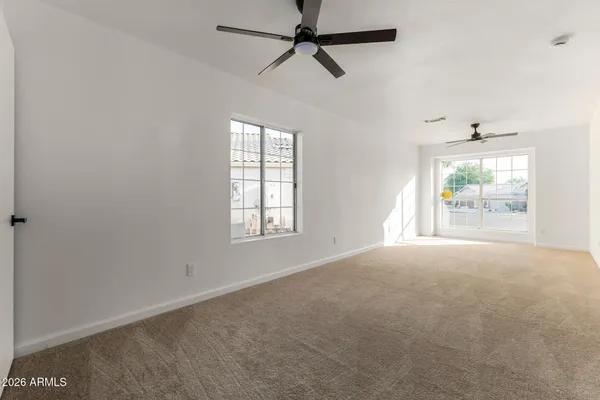 a view of an empty room with a window