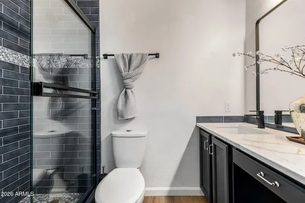 an empty room with closet and a window