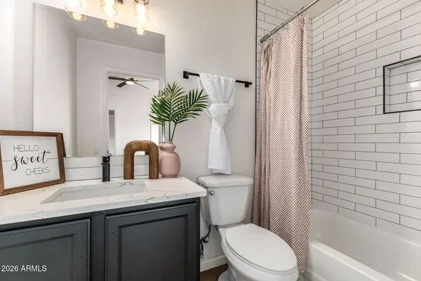 a living room with furniture a window and a table