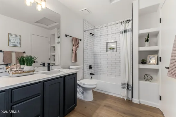 an empty room with closet and ceiling fan