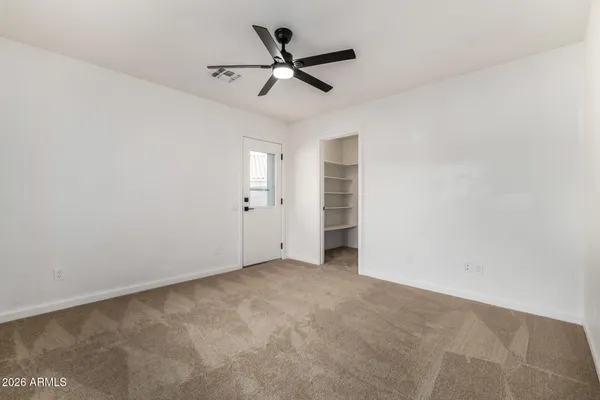 a view of an empty room with a window
