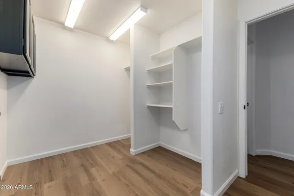 a view of hallway with wooden floor