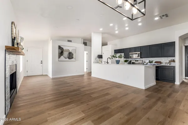 a view of kitchen with cabinets and wooden floor