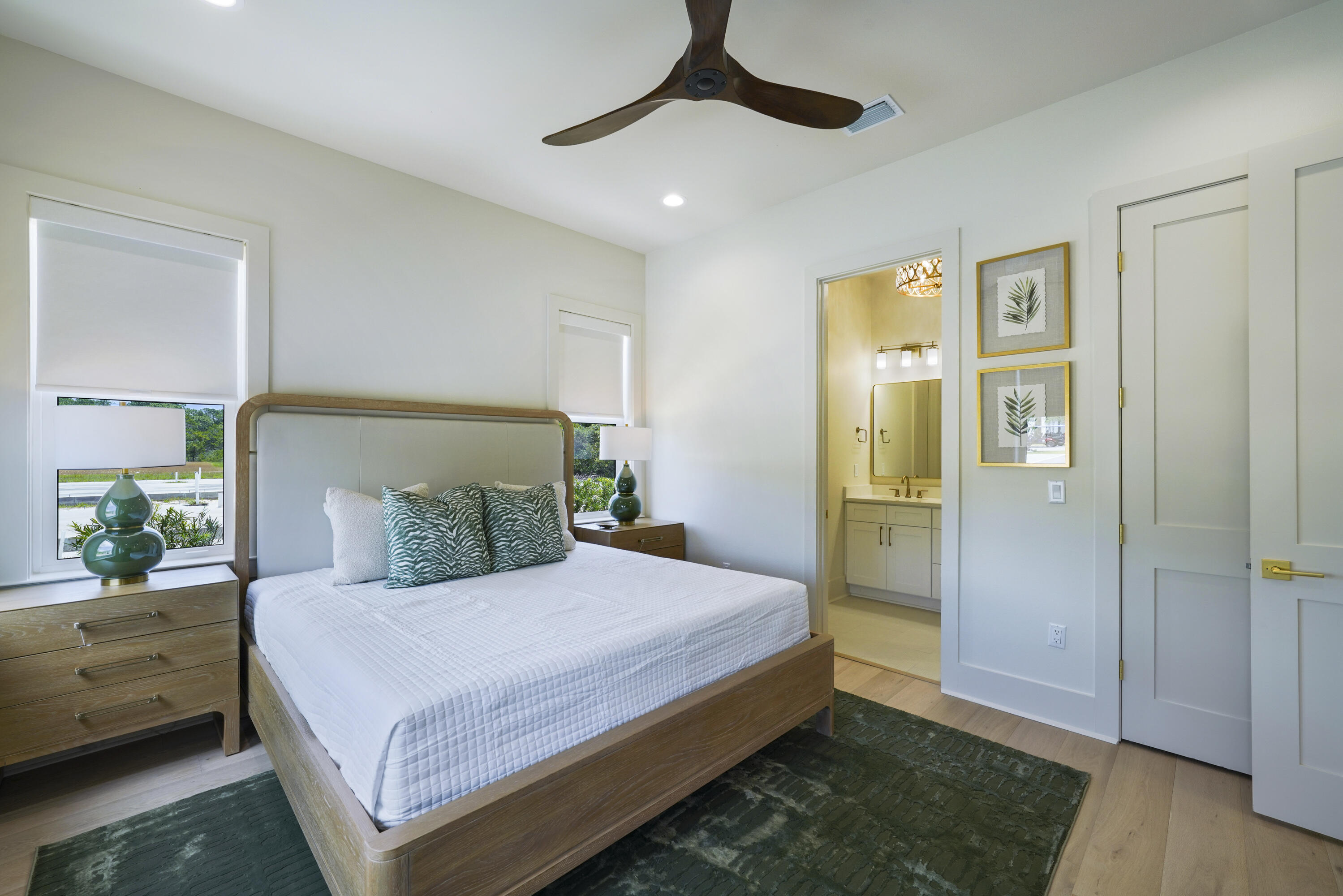 56 Sea Croft Cove Santa Rosa Beach, FL 32459 - Photo 2 of 65 a bedroom with a large bed and a chandelier