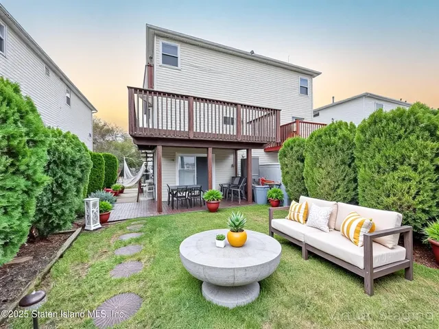 a view of a chairs and table on the deck