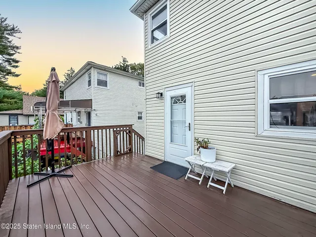 a outdoor space with the couches and dining table view