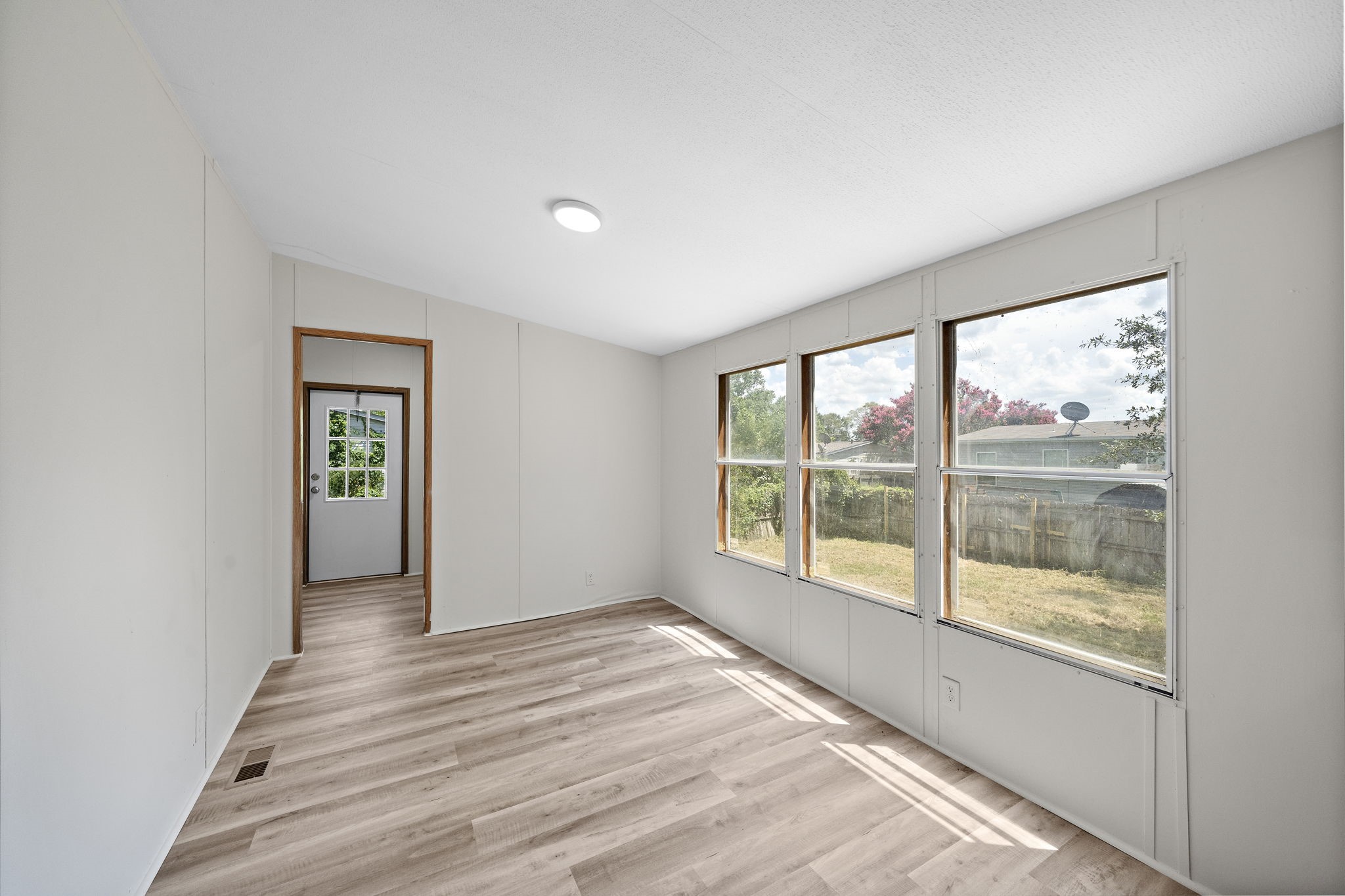16482 Pisces Road Conroe, TX 77306 - Photo 16 of 35 a view of wooden floor and windows in a room