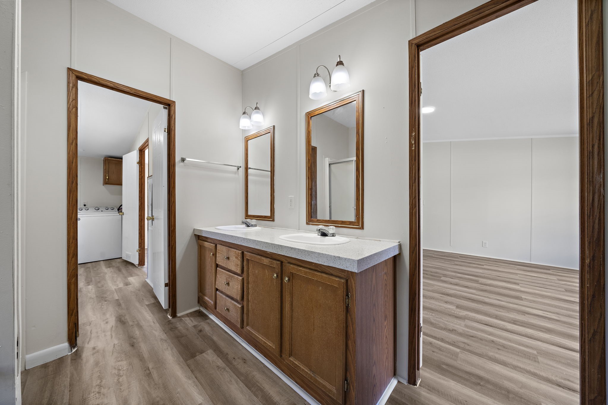 16482 Pisces Road Conroe, TX 77306 - Photo 20 of 35 a bathroom with a sink a mirror and a shower
