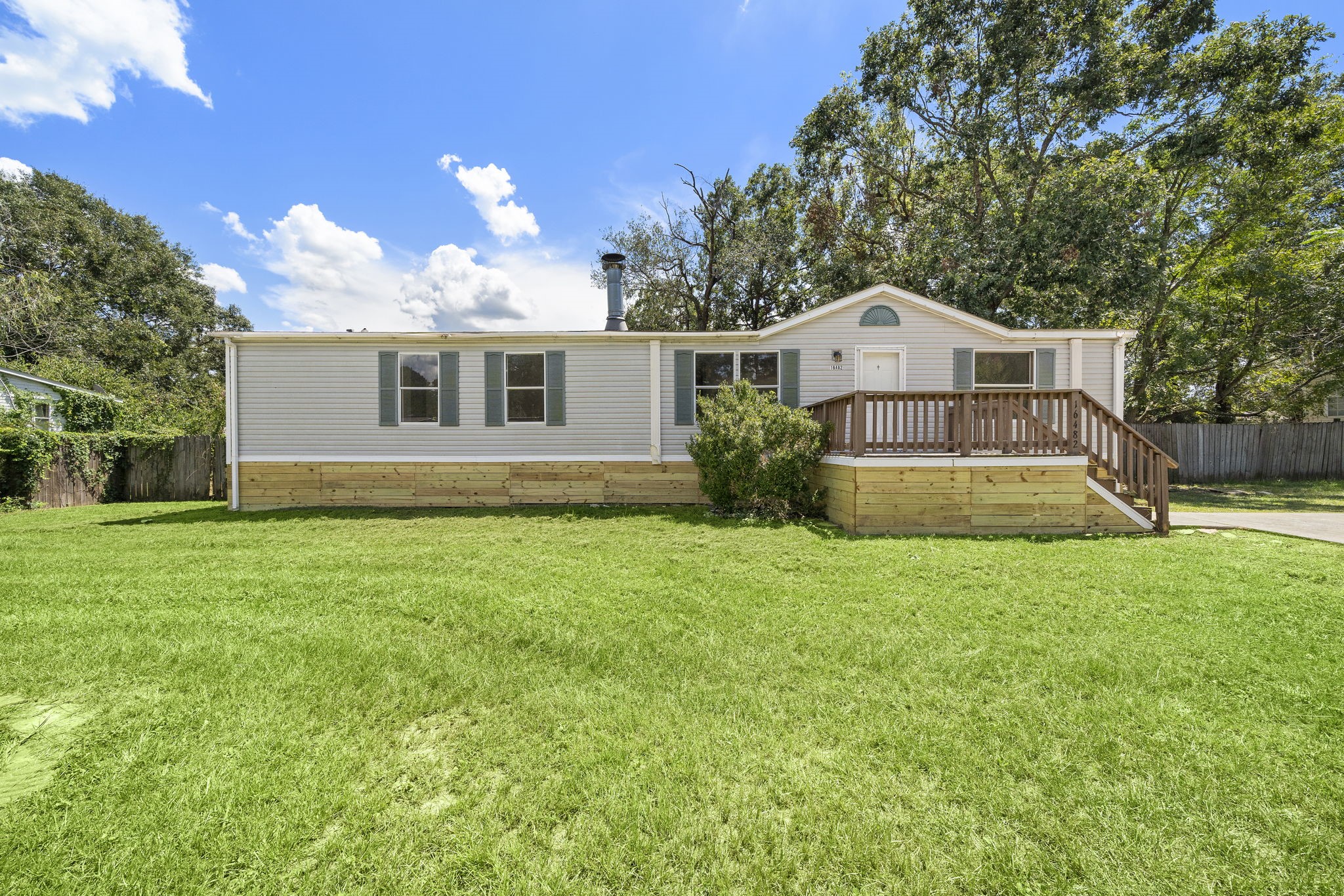 16482 Pisces Road Conroe, TX 77306 - Photo 2 of 35 a view of a house with backyard and garden