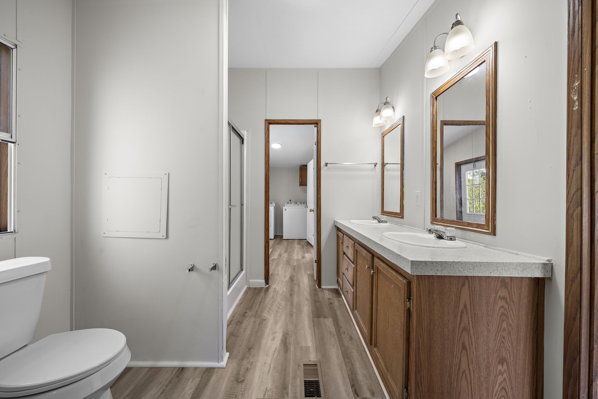 16482 Pisces Road Conroe, TX 77306 - Photo 21 of 35 a bathroom with a sink a toilet a mirror and shower