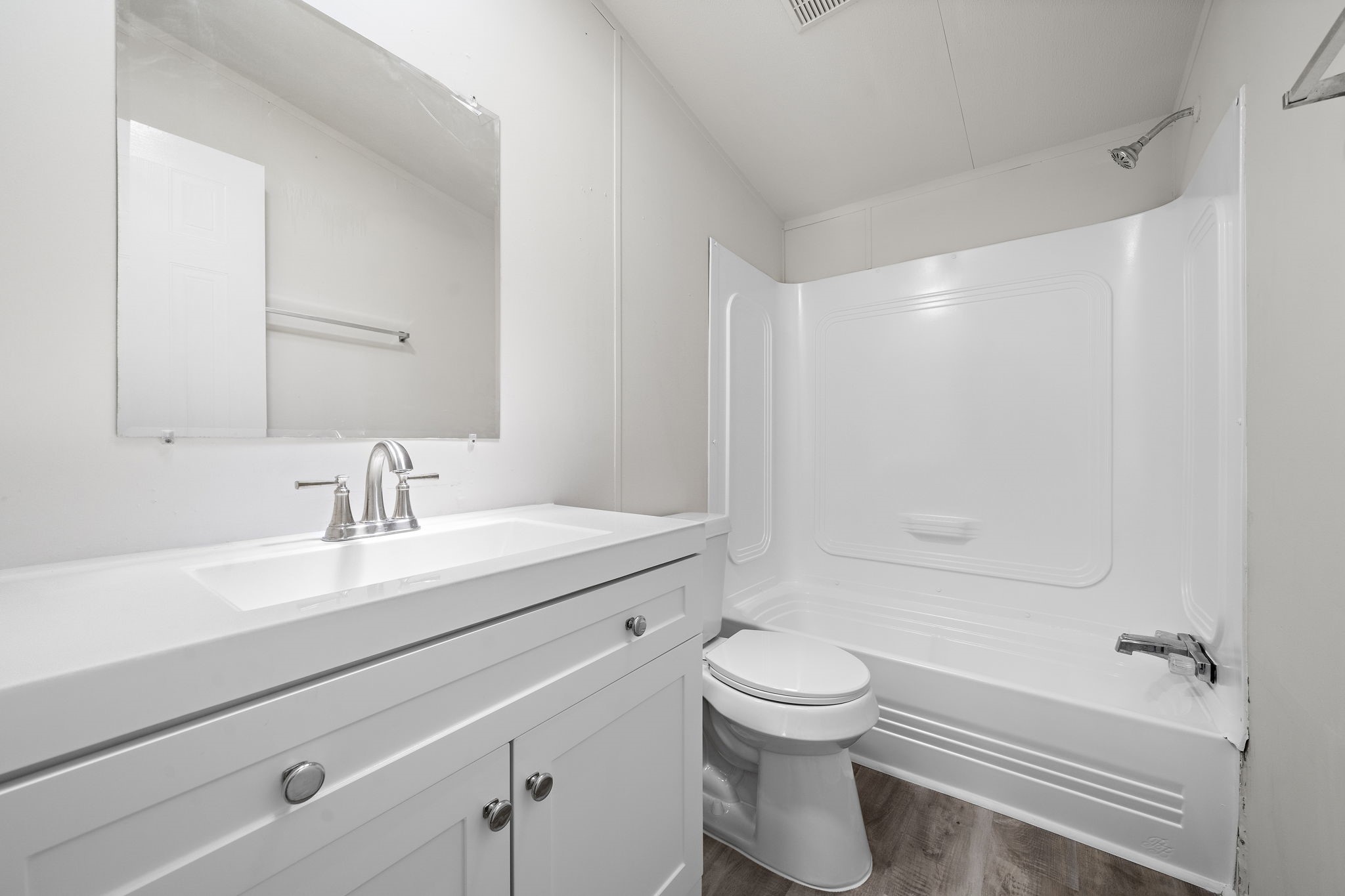 16482 Pisces Road Conroe, TX 77306 - Photo 28 of 35 a bathroom with a sink a toilet and shower