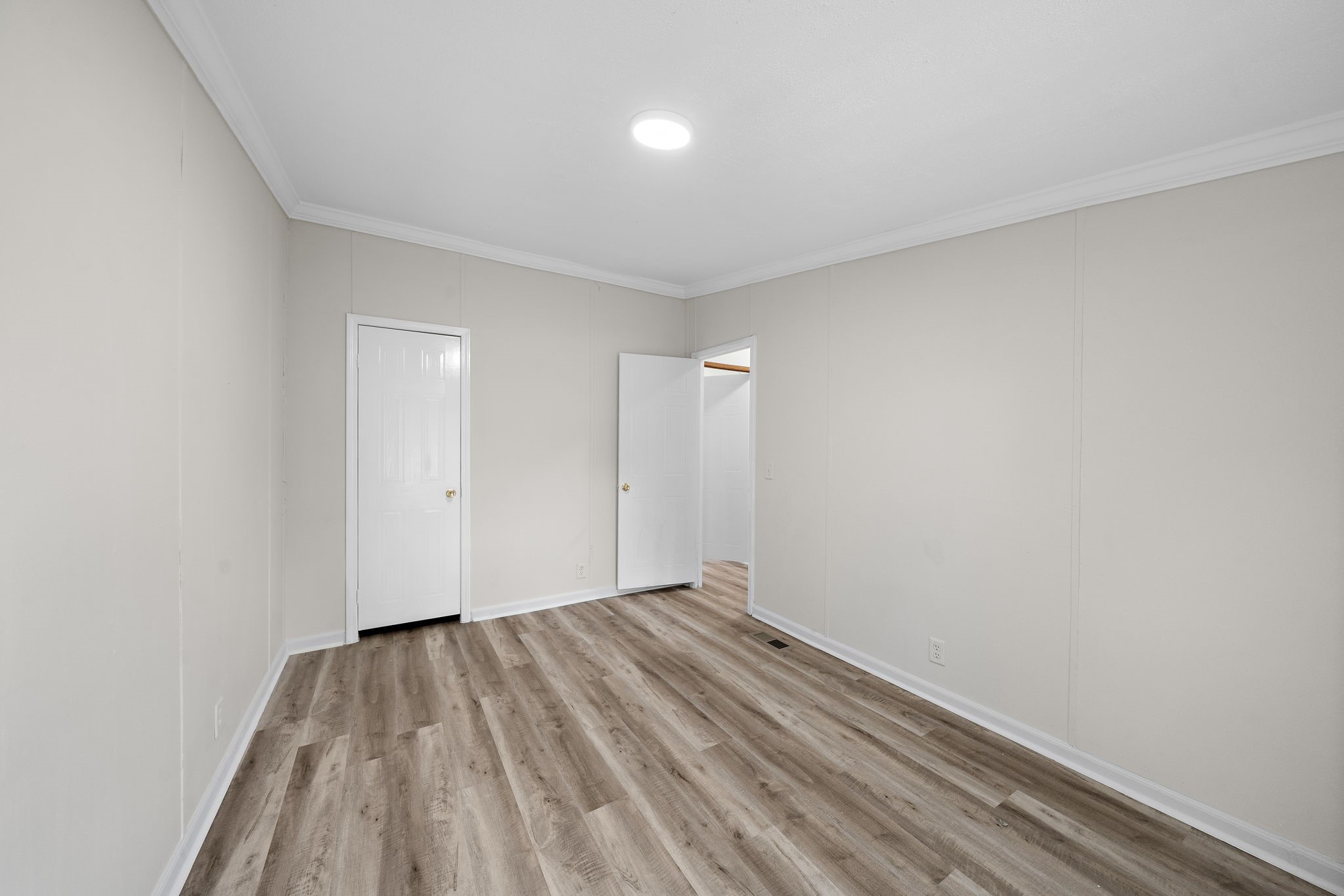 16482 Pisces Road Conroe, TX 77306 - Photo 29 of 35 a view of room with wooden floor