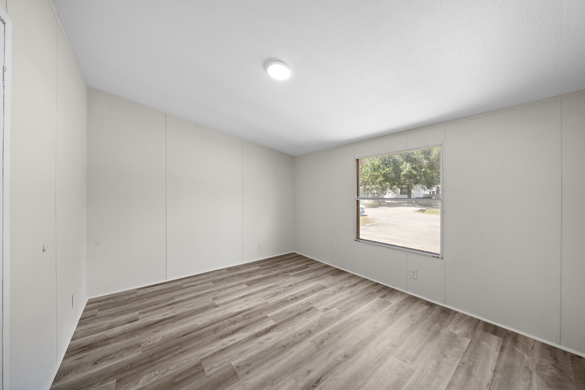 16482 Pisces Road Conroe, TX 77306 - Photo 30 of 35 an empty room with a window