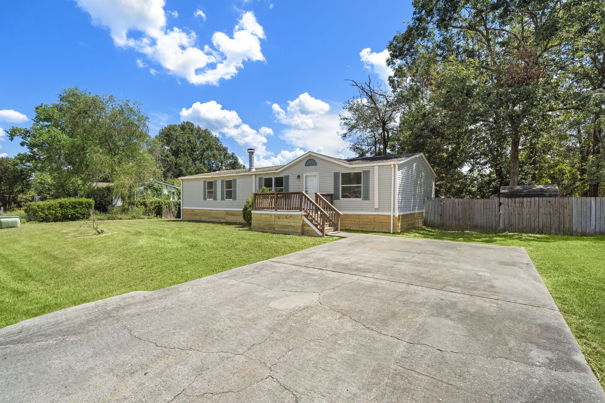 16482 Pisces Road Conroe, TX 77306 - Photo 3 of 35 a view of a house with a back yard