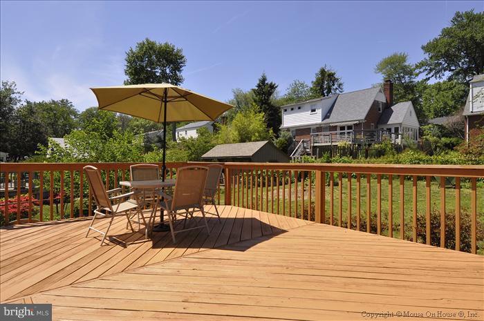 1807 Myrtle Road Silver Spring, MD 20902 - Photo 13 of 27 a view of a roof deck with dining table and chairs