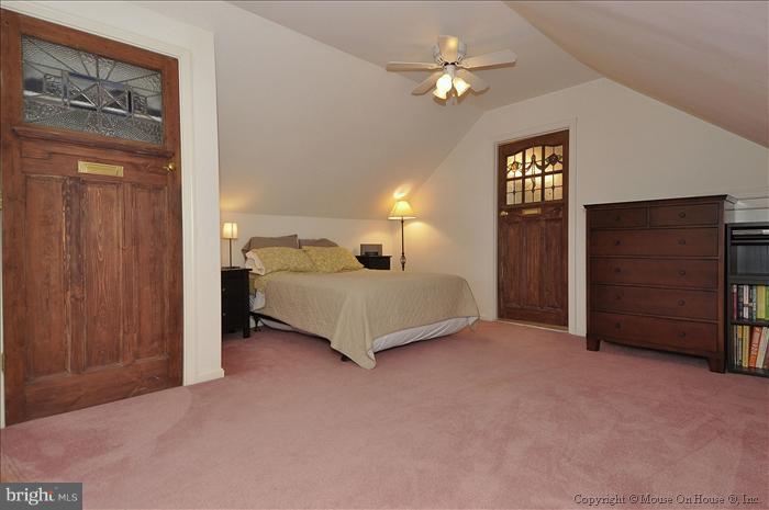 1807 Myrtle Road Silver Spring, MD 20902 - Photo 15 of 27 a bedroom with a bed and a chandelier