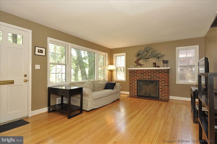 1807 Myrtle Road Silver Spring, MD 20902 - Photo 3 of 27 a living room with furniture and a fireplace